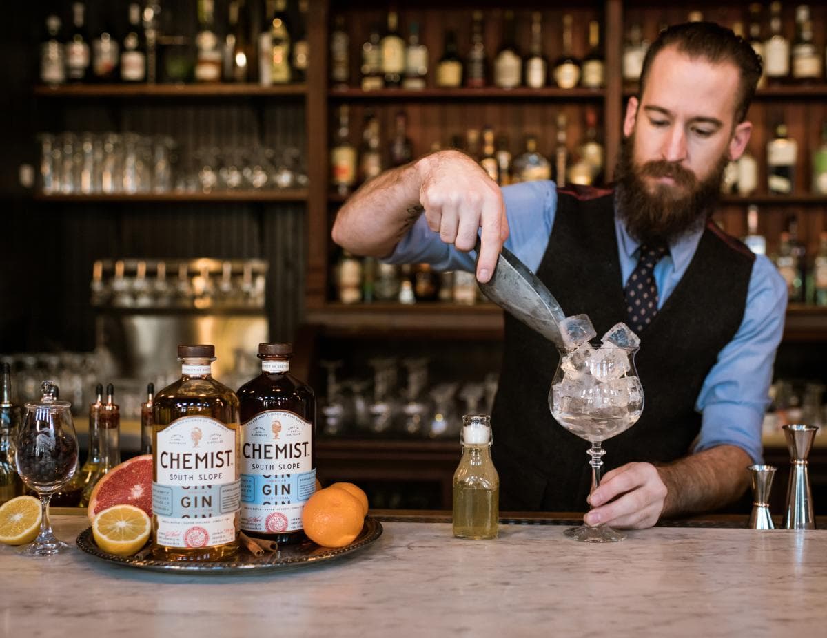 Man making a gin drink at Antidote Man making a gin drink at Antidote