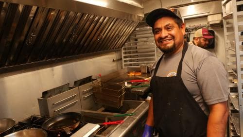 Chef Marcario Jimenez standing in kitchen of his food truck Chef Marcario Jimenez standing in kitchen of his food truck