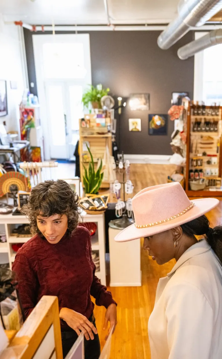 Downtown Asheville Shopping Women shopping Downtown looking at pottery