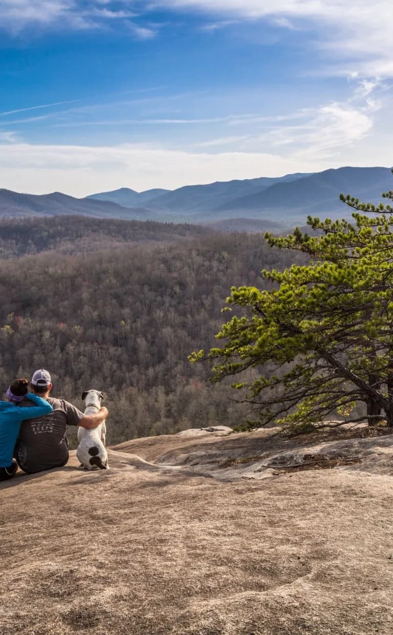 Asheville Date Night Itinerary: Adventure Couple on Slate Rock in Pisgah National Forest with dog / Photo: Jared Kay