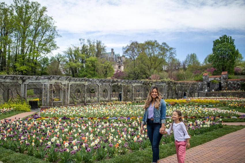 Mother and daughter standing in the gardens at Biltmore Estate Mother and daughter standing in the gardens at Biltmore Estate